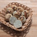 this picture showes multiple plain franconia buns in a basket