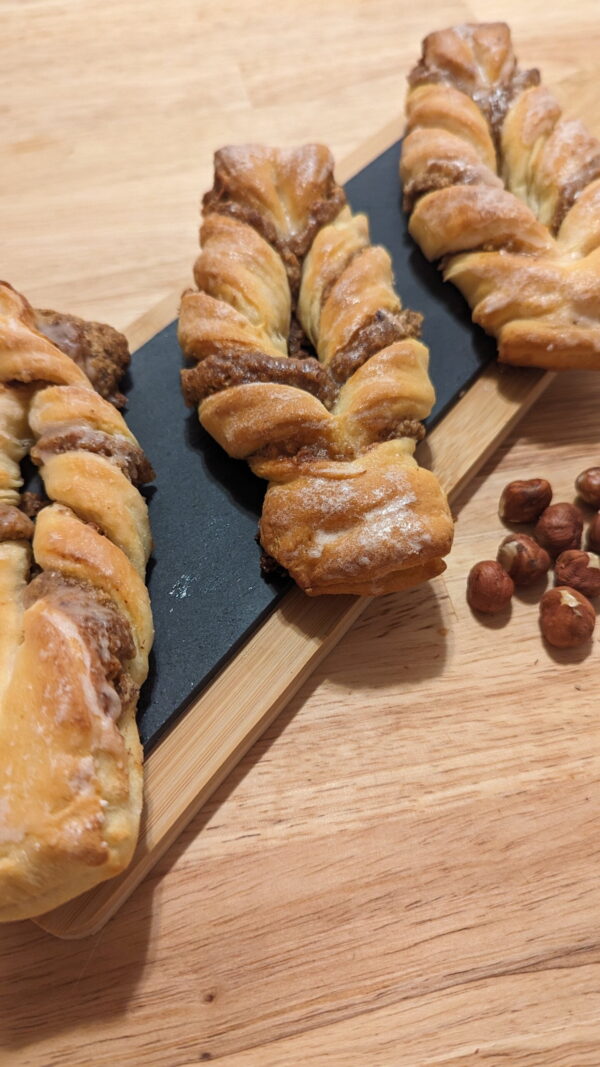 hazelnut bow close This picture shows 3x light hazelnut bow on a wooden plate zoomed in