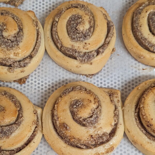 hazelnut swirl 02 This image shows multiple hazelnut swirls on a baking tray