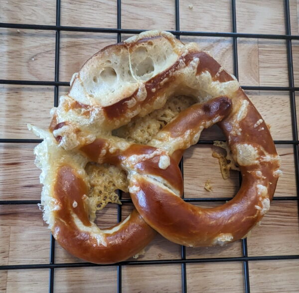 bretzel-emmentaler image of the original bavarian bretzel, topped with Emmental cheese from Swiss, even our photographer could not resist this delicious treat