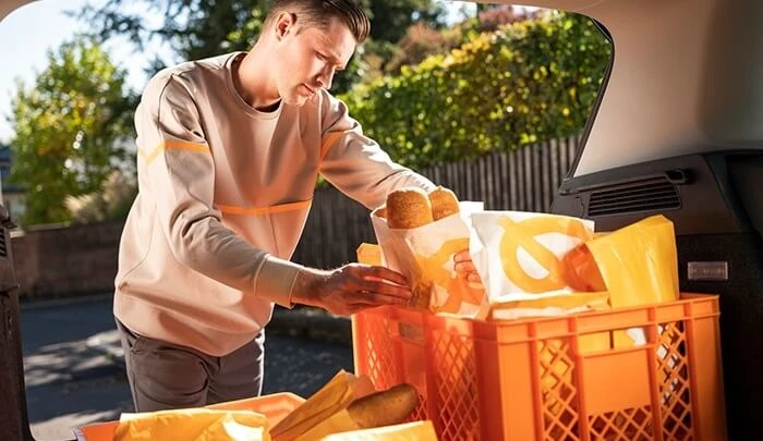 breakfast delivery early in the morning selecting bread bags