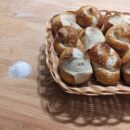 Bretzel bun and knot a basket of bretzel buns and knots on a table
