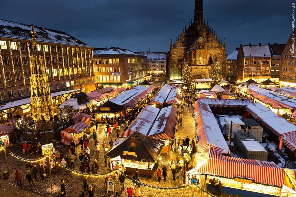 picturesque "village of wood and cloth." Wooden stalls adorned with festive decorations