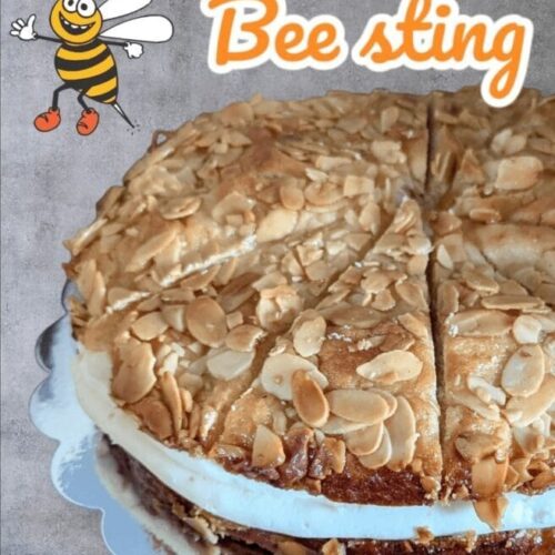Delicious Bee Sting (Bienenstich) cake with soft dough, honey-caramelized almonds, and a rich vanilla pastry cream filling, topped with a golden, sweet almond glaze